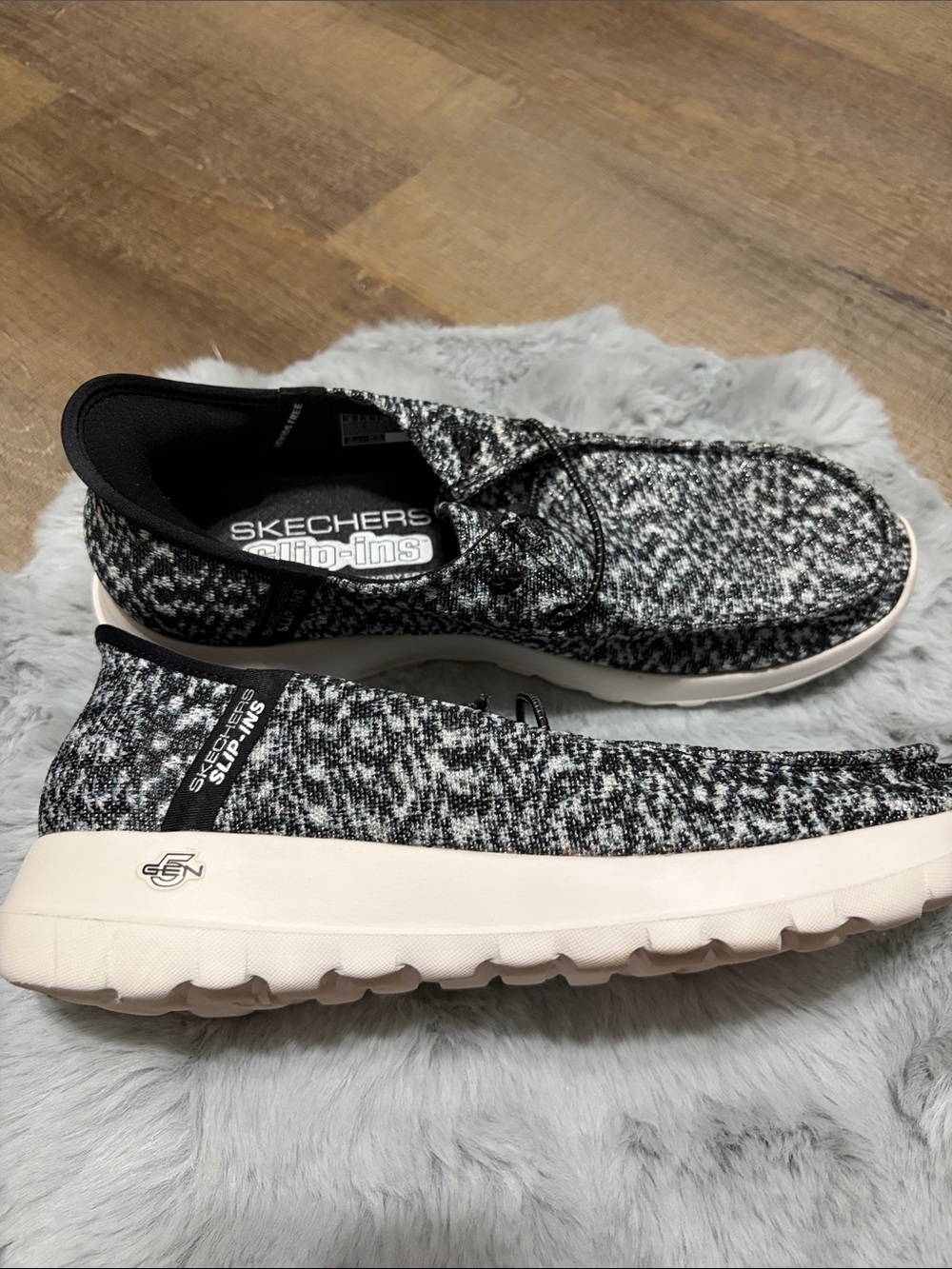 Skechers GO WALK Slip-ins featuring a black and white heathered knit upper. - Picture 3 of 8